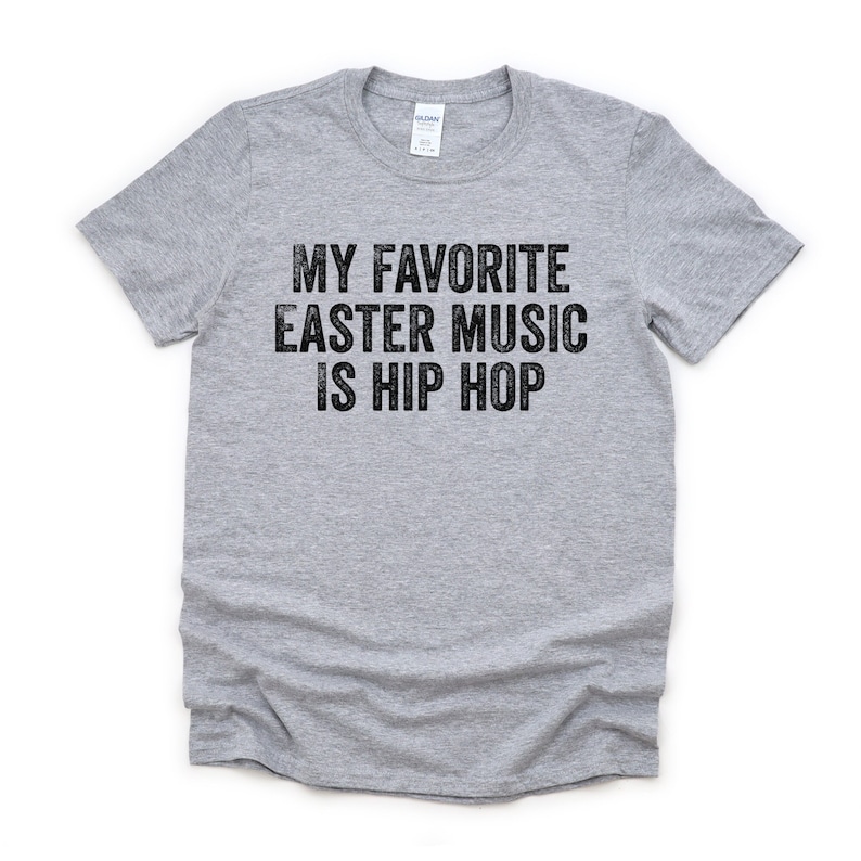May include: A gray t-shirt with the text "My favorite Easter music is hip hop" printed in black.