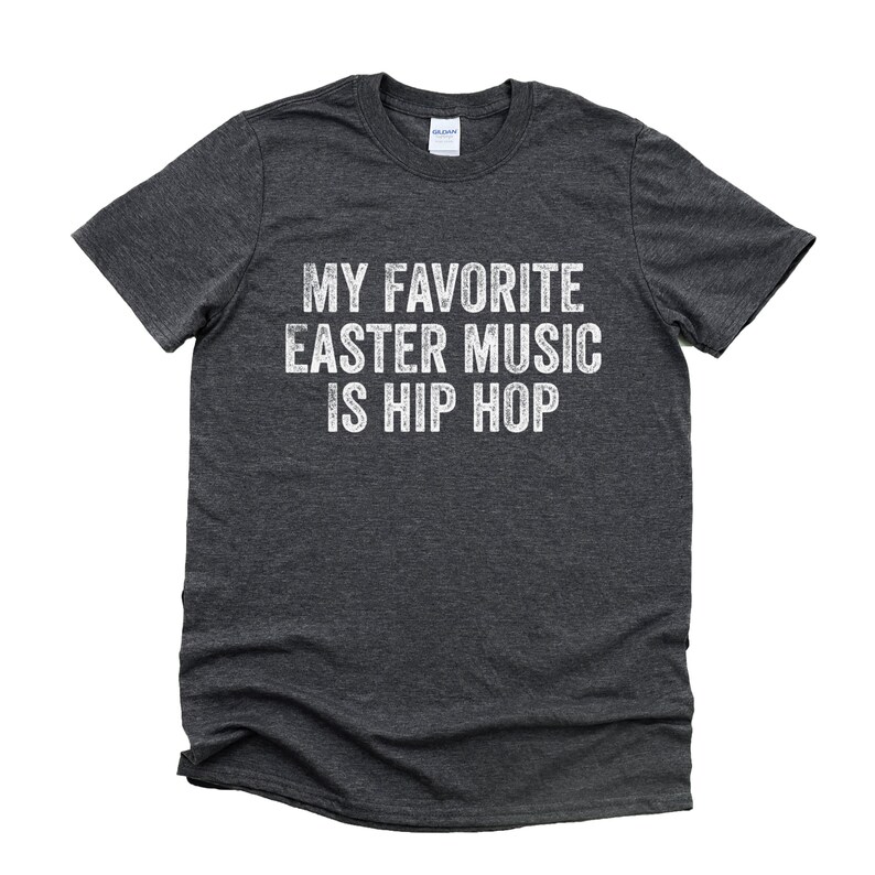 May include: Dark grey t-shirt with white text that reads "My favorite Easter music is hip hop".