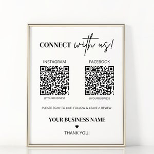 May include: Black and white printable sign with the text "CONNECT with us!" and two QR codes. The QR codes are labeled "INSTAGRAM" and "FACEBOOK" with the text "@YOURBUSINESS" below each. The sign also includes the text "PLEASE SCAN TO LIKE, FOLLOW & LEAVE A REVIEW" and "YOUR BUSINESS NAME". The sign ends with the text "THANK YOU!" and a heart symbol.