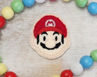 Motif de broderie Marco Feltie, plombier
