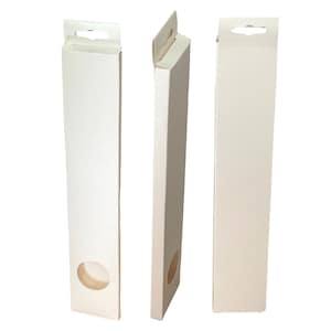 May include: Three off-white rectangular product boxes with a die-cut oval window and a hang tab. The boxes are shown from different angles, highlighting their shape and design. The boxes are empty and ready for product packaging.