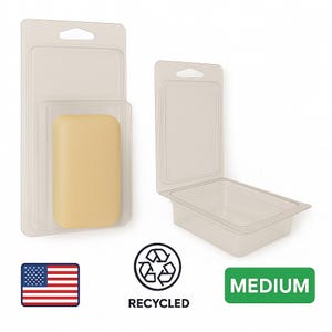 May include: Clear plastic clamshell packaging with a medium-sized, rectangular, light yellow bar of soap inside. The packaging is labeled "MEDIUM" and includes a recycling symbol and an American flag.