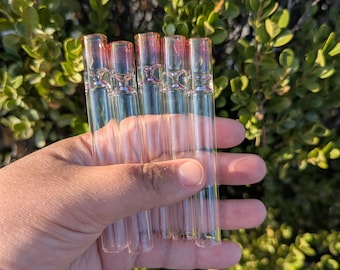 May include: Five clear glass tubes with a subtle iridescent pink tint at the top end. Each tube features a small, indented circular notch near the upper section, creating a distinct constriction in the glass cylinder design for these items.