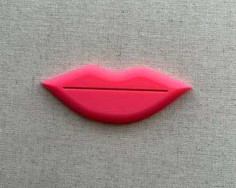 Exprimidor de tubo en forma de labio