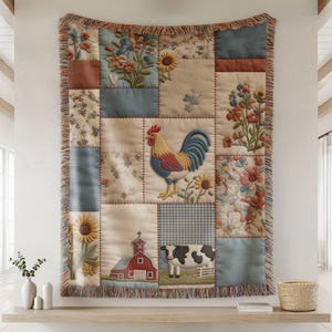 May include: A patchwork tapestry with a farm theme. The tapestry features embroidered images of a rooster, sunflowers, a red barn, and a cow. The tapestry is framed with a fringed border and is displayed on a wall.