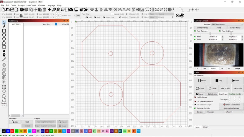 May include: A computer screen displaying a design program with a red octagon shape and three circles inside. The design is on a grid background.
