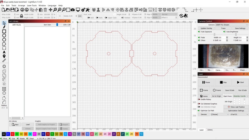 May include: A computer screen displaying a design program with a grid pattern. Two red octagonal shapes with a circle in the center are visible on the screen.