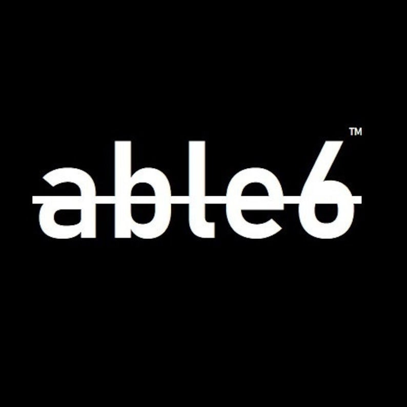 May include: A white logo on a black background with the text "able6" and a trademark symbol.