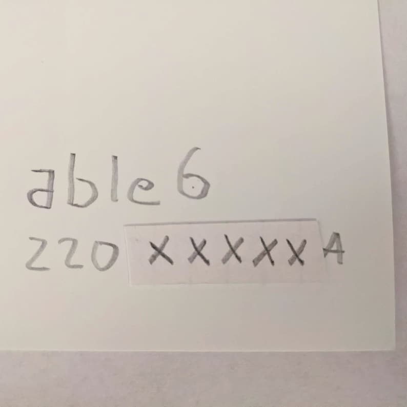 May include: A handwritten note that says "able 6" and "220" with a blacked out area that says "XXXXXXA"