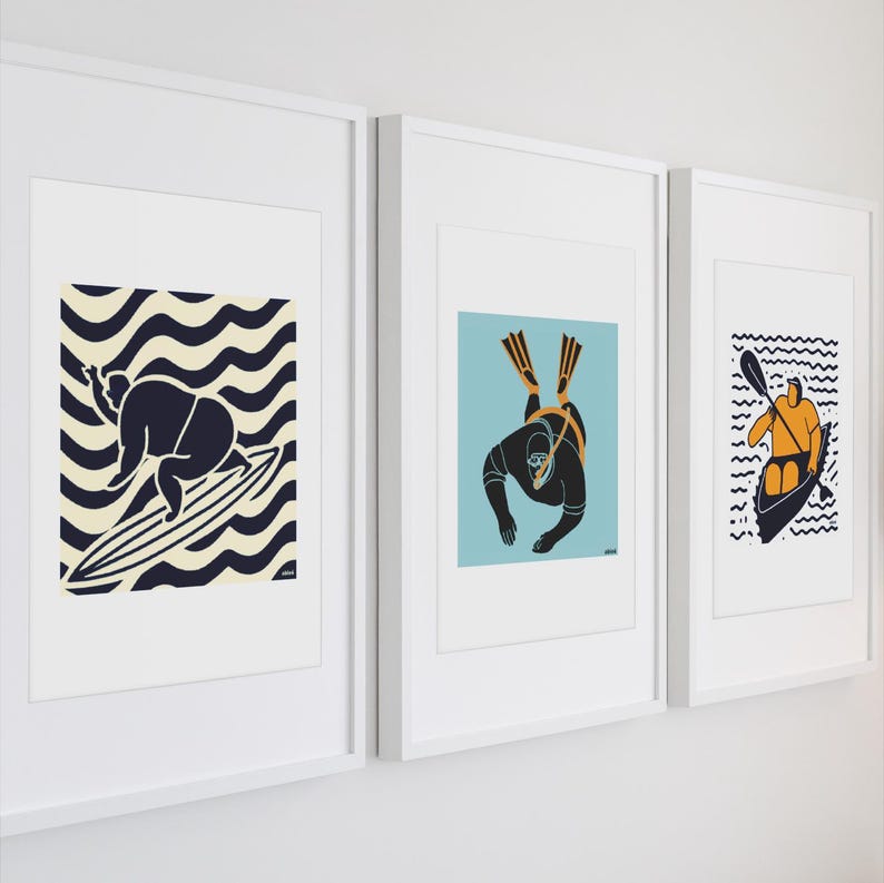 May include: Three framed illustrations of people engaged in water sports. The first shows a person surfing on a wave, the second shows a person scuba diving, and the third shows a person kayaking.