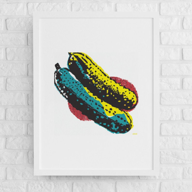 May include: A colorful illustration of two green and yellow pickles on a white background. The pickles are overlapping and have a red and yellow background.