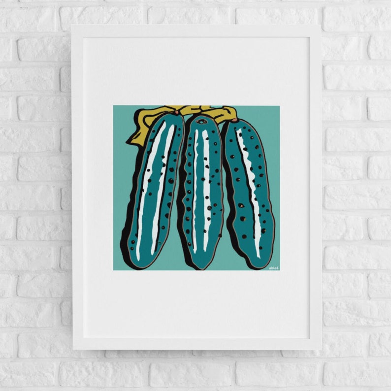 May include: Three teal green cucumbers with yellow tops and black speckles, arranged vertically on a teal green background.