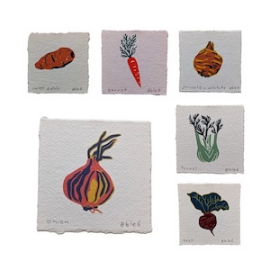 May include: Six illustrated cards with the names and images of different vegetables: sweet potato, carrot, Jerusalem artichoke, fennel, onion, and beet.