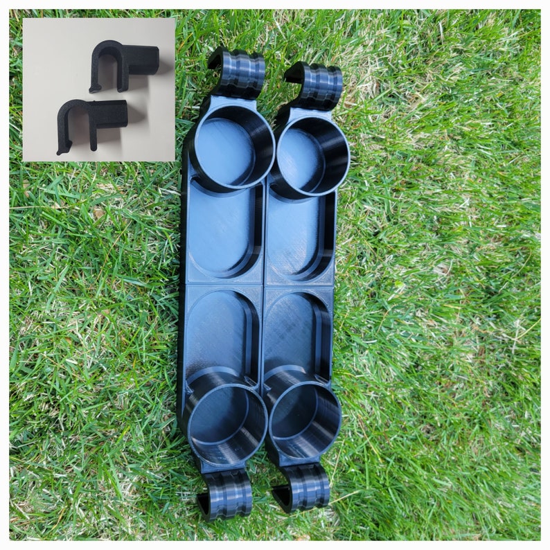 May include: Two black plastic cup holders with four cup slots. Each holder has a hook on the top for hanging.