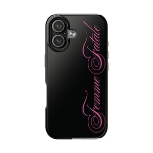 May include: Black phone case with a pink script font that reads "Femme Fatale". The case has a glossy finish and a camera cutout on the upper left corner. The phone case is designed to protect the phone.