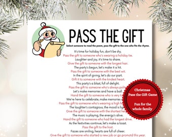 May include: A red and white Christmas-themed game card with a cartoon Santa Claus holding a scroll. The card has the title "Pass the Gift" and instructions for a holiday game. The text includes phrases like "It's time for holiday fun, don't be shy" and "Pass the gift to someone who's wearing a holiday tie."