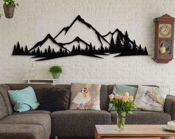 May include: Black metal mountain range wall art. The silhouette depicts a mountain range with trees. The artwork is mounted on a white brick wall above a brown sectional sofa with decorative pillows and a wooden coffee table.