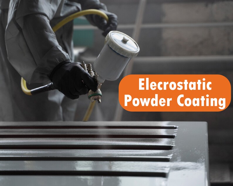 May include: A worker wearing a white protective suit uses an electrostatic powder coating gun to apply a grey powder coating to a metal surface. The text "Electrostatic Powder Coating" is visible in the image.