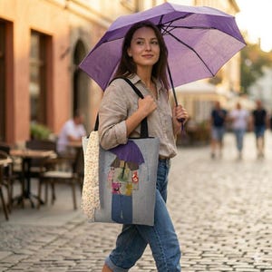 May include: A set of three ceramic mugs with a speckled, matte finish. The mugs are in shades of cream, light gray, and dark gray. Each mug has a simple, modern design and a rounded handle. The mugs are stacked on top of each other.