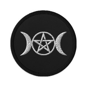 May include: A black embroidered patch with a white triple moon symbol and a pentagram in the center.