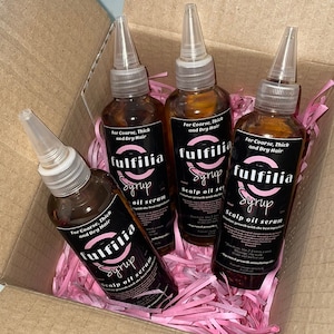 May include: Four brown glass bottles with black labels and white text that reads "fulfilia syrup scalp oil serum" for coarse, thick and dry hair. The bottles are in a cardboard box with pink shredded paper.