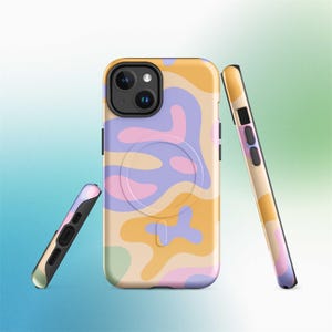 May include: A set of three phone cases with a colorful, abstract design. The cases feature a pattern of flowing shapes in shades of yellow, purple, pink, and green. The cases are shown from different angles, highlighting the design and the phone's camera.