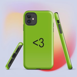 May include: Lime green phone case with a black heart symbol and the number 3. The case is shown from multiple angles, highlighting its design and the phone's camera and buttons. The case has a black border.
