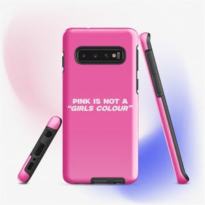 May include: A bright pink phone case with a black camera cutout and the text "PINK IS NOT A 'GIRLS COLOUR'" in white. The case is shown from multiple angles, highlighting its design and color.
