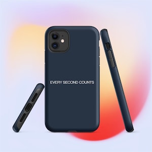 May include: Navy blue phone case with the text "EVERY SECOND COUNTS" in white. The case is shown from multiple angles, highlighting the design and the phone's camera and buttons. The background has a blurred gradient of pink, yellow, and purple.