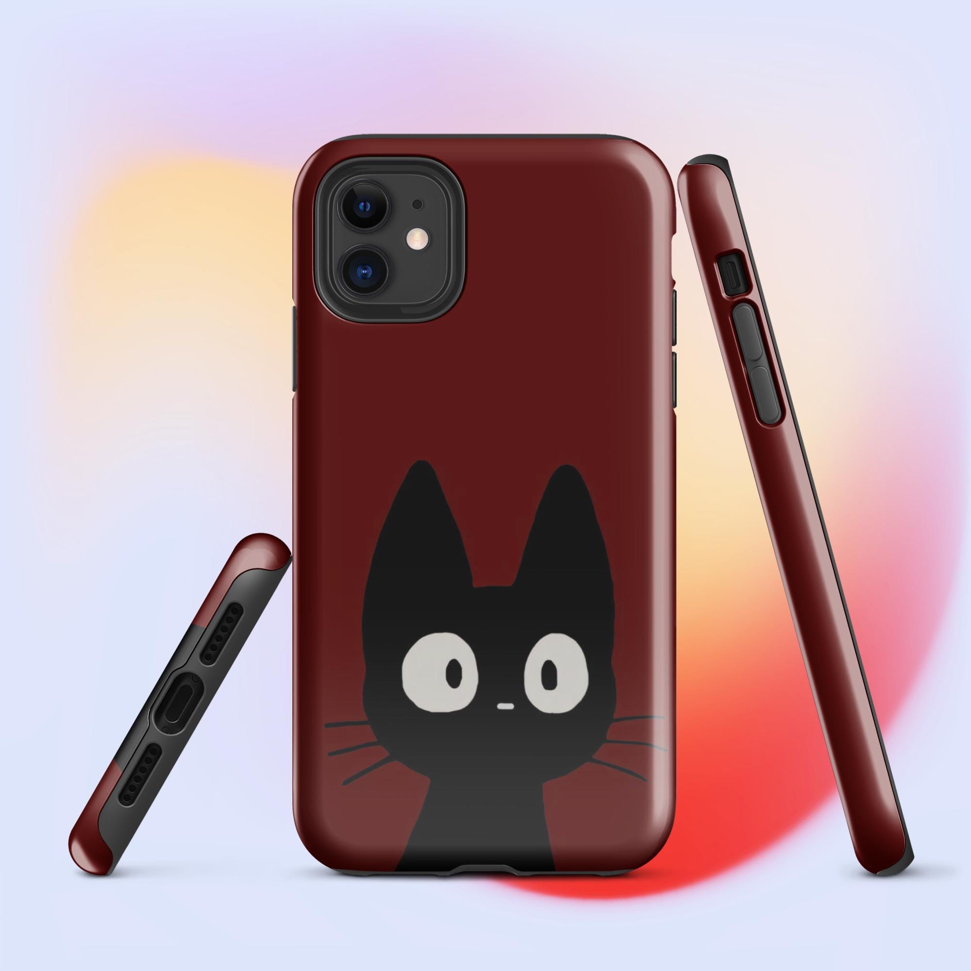 スタジオジブリ「魔女の宅急便」猫と濃い赤の背景のタフなiPhoneケース