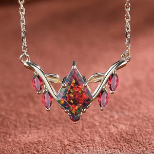 Kite Black Fire Opal Necklace: Sterling Silver Leaf Pendant, Garnet Accent