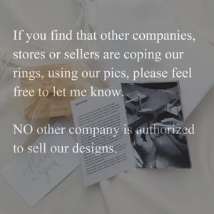 May include: A close-up of a note with the text "NO other company is authorized to sell our designs."  The note is on a white surface with a small wooden box and a black and white photo of a hand working on a piece of jewelry.
