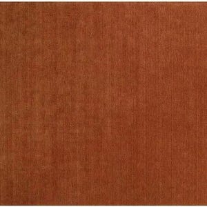 May include: A rectangular, solid rust-colored rug. The rug has a woven texture, with visible vertical lines. The color is a warm, earthy tone, suitable for various interior design styles. The rug is a large size.