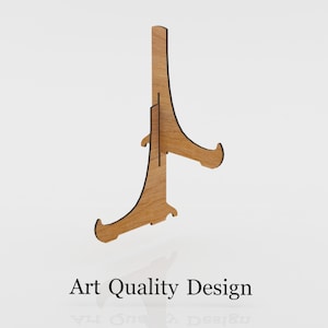 Puede incluir: Un caballete de madera con un acabado de madera natural. El caballete est&aacute; dise&ntilde;ado para sostener un plato u otro objeto plano.