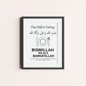 Puede incluir: Impresión enmarcada en negro con el texto "Dua Before Eating" en inglés y árabe. La impresión incluye una ilustración de plato y tenedor, y las palabras "Bismillah Wa Ala Barkatillah". La parte inferior dice "En el nombre de Allah y con las bendiciones de Allah, empiezo (a comer)."