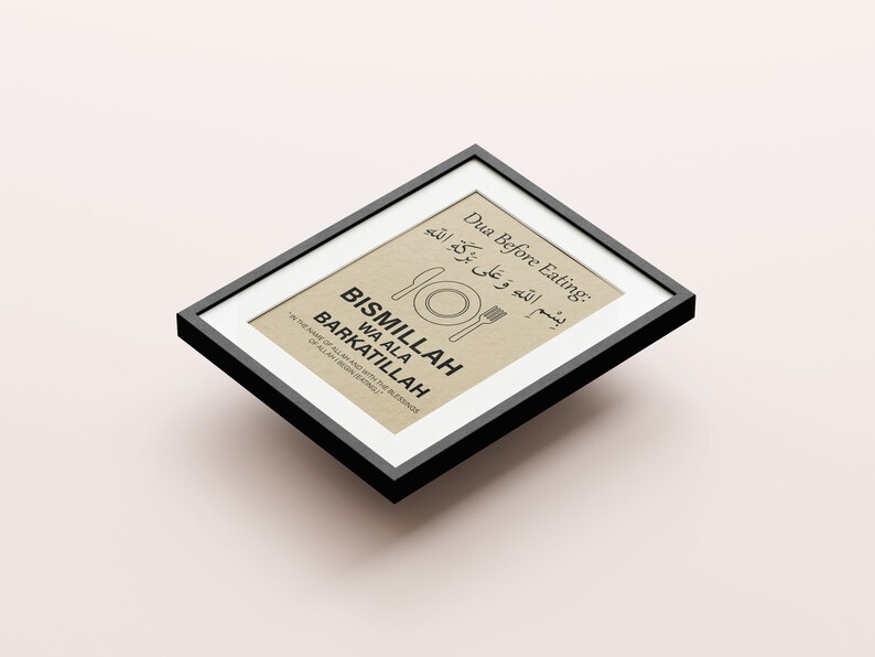 May include: Framed print with black border featuring text in English and Arabic. The text includes "Dua Before Eating" and "Bismillah Wa Ala Barkatillah" with a knife, fork, and plate illustration. The background is a light tan color.