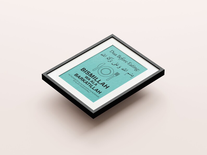 May include: A framed print with a teal background and black text. The text includes "Dua Before Eating" and "BISMILLAH WA ALA BARKATILLAH" with an illustration of a plate, knife, and fork. The frame is black.
