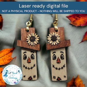May include: A pair of wooden dangle earrings featuring a scarecrow face design with a sunflower on a brown hat, gold-tone metal hooks, and the text Laser ready digital file NOT A PHYSICAL PRODUCT - NOTHING WILL BE SHIPPED TO YOU.