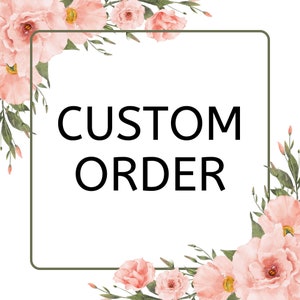 May include: A white square with the words "CUSTOM ORDER" in black, framed by a green border. The corners are adorned with watercolor-style pink flowers and green leaves, creating a floral design.