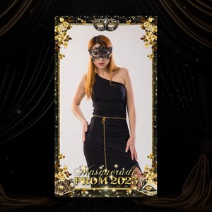 May include: A black and gold masquerade prom photo booth backdrop with a black lace mask and the text "Masquerade Prom 2025".