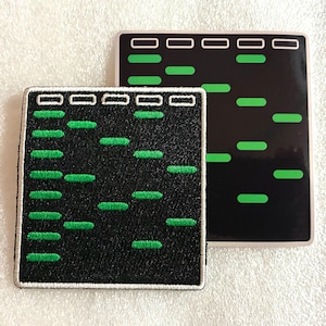 May include: A square embroidered patch and a matching square sticker featuring a black background with a grid of white outlined rectangles at the top and rows of horizontal bright green bars arranged in a pattern resembling DNA gel electrophoresis.