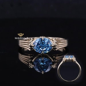 Ost nach West Diamantring im Ovalschliff, ausgefallener Vivid Blauer ovaler Diamant-Verlobungsring, 14 Karat Gelbgoldring, Art-Deco-Ring für sie.