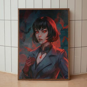 Peut inclure: Impression artistique encadrée représentant une femme aux yeux rouges et aux cheveux noirs. Elle porte un manteau bleu, des gants rouges et un pendentif rouge. Le fond est sombre avec des silhouettes de chauves-souris.