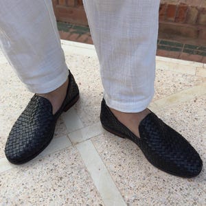 Handmade men’s braided leather shoes featuring a woven design and classic driving moccasin style. These leather loafers offer a comfortable, flexible fit ideal for weddings, groom fashion, and stylish everyday wear. Crafted with detailed braided texture for a refined, elegant look that complements both formal and casual outfits.