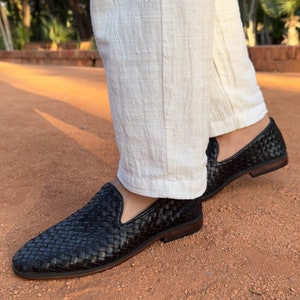 Handmade men’s braided leather shoes featuring a woven design and classic driving moccasin style. These leather loafers offer a comfortable, flexible fit ideal for weddings, groom fashion, and stylish everyday wear. Crafted with detailed braided texture for a refined, elegant look that complements both formal and casual outfits.