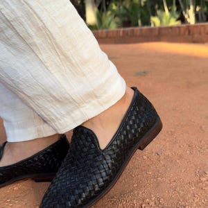 Handmade men’s braided leather shoes featuring a woven design and classic driving moccasin style. These leather loafers offer a comfortable, flexible fit ideal for weddings, groom fashion, and stylish everyday wear. Crafted with detailed braided texture for a refined, elegant look that complements both formal and casual outfits.