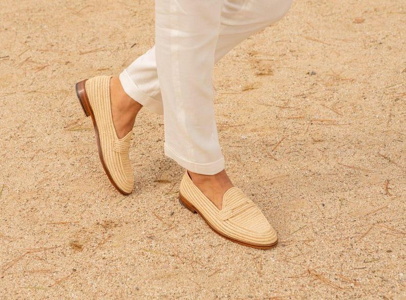 Handmade men’s raffia wedding shoes featuring natural woven fibers and a lightweight loafer design. Perfect for grooms seeking unique, stylish footwear for beach, boho, or summer ceremonies. Comfortable, breathable, and crafted with detailed handwoven texture for an elegant, natural look.