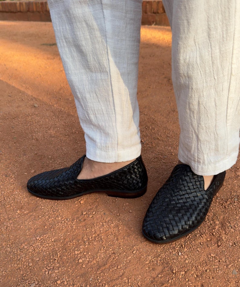 Handmade men’s braided leather shoes featuring a woven design and classic driving moccasin style. These leather loafers offer a comfortable, flexible fit ideal for weddings, groom fashion, and stylish everyday wear. Crafted with detailed braided texture for a refined, elegant look that complements both formal and casual outfits.