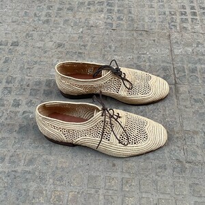 Handmade men’s raffia shoes crafted from natural woven fibers, featuring a lightweight and breathable loafer moccasin design. Ideal for weddings, beach ceremonies, summer outfits, and casual everyday wear. These artisanal raffia loafers offer a stylish, eco-friendly look with detailed handwoven texture, comfortable fit, and classic design suitable for men seeking unique, handcrafted footwear.