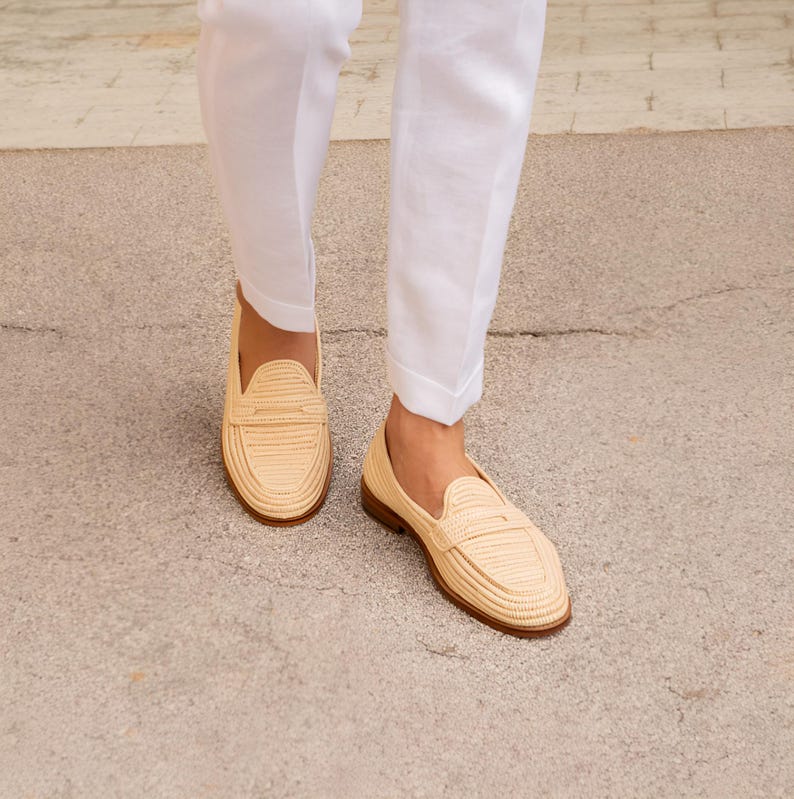 Handmade men’s raffia wedding shoes featuring natural woven fibers and a lightweight loafer design. Perfect for grooms seeking unique, stylish footwear for beach, boho, or summer ceremonies. Comfortable, breathable, and crafted with detailed handwoven texture for an elegant, natural look.